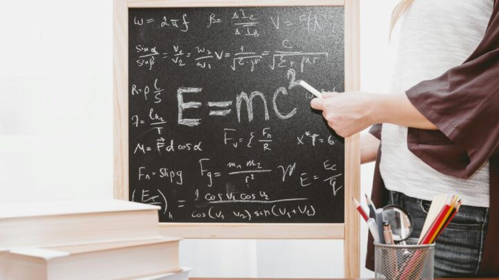E-mc2 written on chalkboard