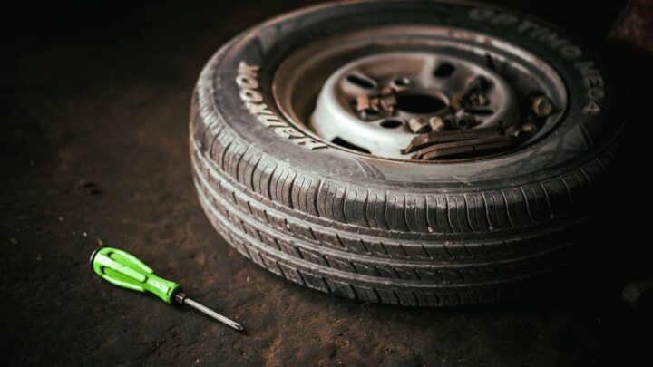 a tire with a wrench next to it