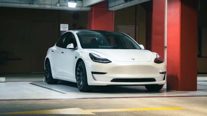 a white car parked in a parking garage